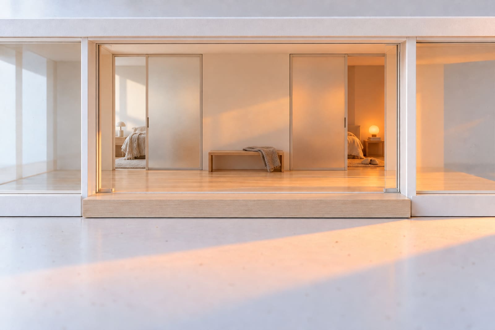 Two frosted sliding doors side by side in the card model's hall, the same size, each slid open on to a quiet room.